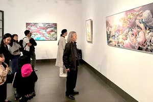 Visitors at the exhibition of outstanding artworks in the 2nd UOB – Painting of the Year competition in HCMC