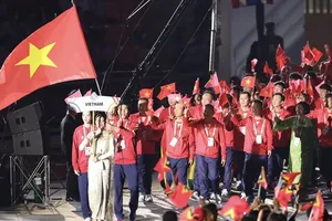The Vietnam Sports Delegation attends the opening ceremony of SEA Games 33 (Photo: SGGP)
