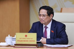 政府总理范明政发表讲话。图自越通社