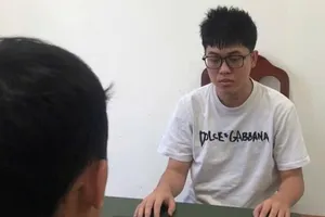 Lê Minh Nghĩa tại cơ quan điều tra. Ảnh: CACC