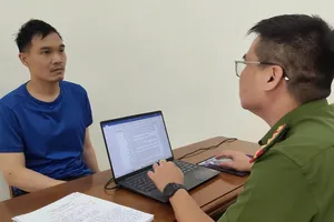 Đối tượng Vũ Hiền tại cơ quan điều tra. Ảnh: CACC