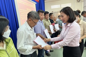 两县向民众支付环市三路项目补偿金