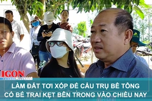 Làm đất tơi xốp để cẩu trụ bê tông có bé trai kẹt bên trong vào chiều nay