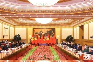 越南黨中央總書記阮富仲與中國共產黨中央委員會總書記、中華人民共和國國家主席習近平進行會談。