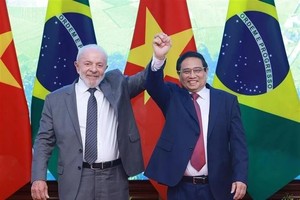 政府总理范明政和巴西总统卢拉。图自越通社