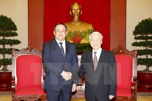 General Secretary of the Communist Party of Vietnam (CPV) Nguyen Phu Trong ​(R) and Lao Deputy Prime Minister Sonexay Siphandone (Source: VNA)