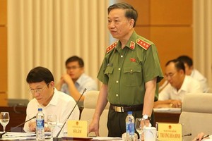 Minister of Public Security To Lam speaks at the question and answer session of the 14th National Assembly Standing Committee on August 13 (Photo: VNA)