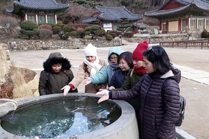 Vietnamese tourists visit Jeondeungsa Temple, Incheon, South Korea.