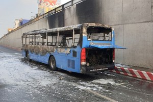 Bus catches fire.