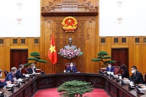 PM Pham Minh Chinh receives Alok Sharma, British Cabinet Minister and President of the 26th United Nations Climate Change Conference (COP 26). (Photo: VNA)