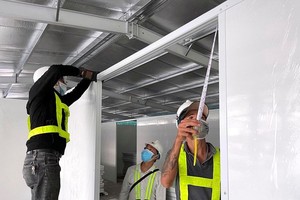 Partitions are installed in a field hospital in District 7.