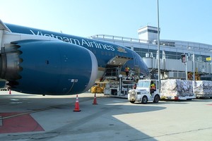 The batch of medical products is brought on the plane at San Francisco International Airport.