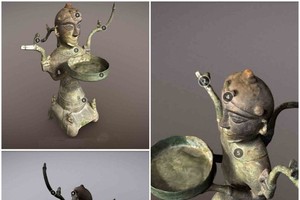 An ancient human-shaped lamp in the Vietnam National Museum of History 