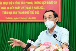 Secretary of the HCMC Party Committee Nguyen Van Nen (L) and Chairwoman of the municipal People’s Council Nguyen Thi Le (R) attend working sessions with Thu Duc City and Cu Chi District respectively to review the localities' implementation of the social d