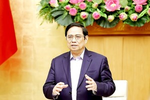 Prime Minister Pham Minh Chinh chairs the meeting on October 16 (Photo: VNA)