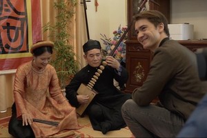  French filmmaker François Bibonne  (R) in the trip  of making "Once upon a bridge in Vietnam" 