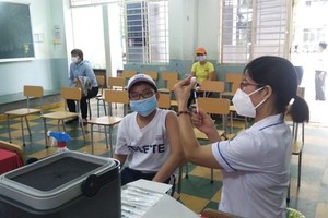 A student of the Colette Secondary School of District 3 gets Covid-19 vaccine.