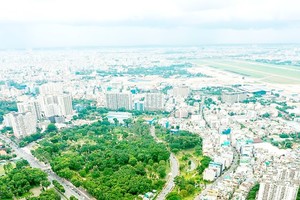 The construction of an overpass on Truong Son road helps ease traffic congestion around Tan Son Nhat airport.
