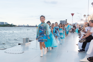 Kid models perform in the fashion show.