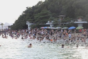 Tourists visit Ha Long Bay in July.