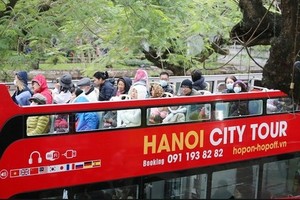 The double-decker bus city tour is expected to help visitors to explore Hanoi from a different view. (Photo: SGGP)