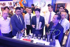 Visitors at a mechanical and electrical devices and digital technology fair opens in HCM City on June 1. (Photo courtesy of HCMC Investment and Trade Promotion Center)