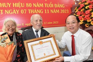 Veteran Party members presented 80-year Party membership badges