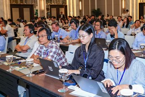 Delegates attend the seminar on "Developing green transportation: challenges and solutions for attracting investment" held on August 21. (Photo: SGGP)