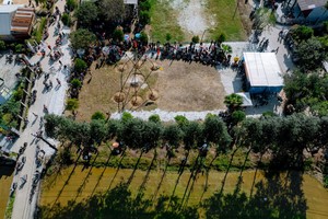 People join swinging chair game to pray for abundant harvests