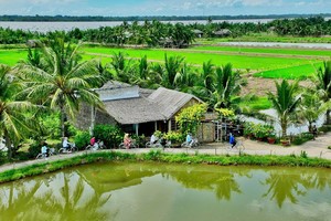 Visitors enjoy a cycling tour in the Con Chim (bird islet) community-based tourism site.