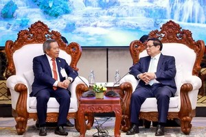 越南政府总理范明政会见老越友好协会中央委员会主席波威恩坎·冯达拉。