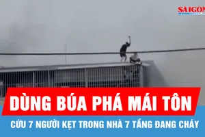 Dùng búa phá mái tôn, cứu 7 người kẹt trong nhà 7 tầng đang cháy