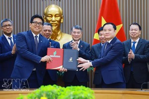 黎明兴总理见证PETRONAS与Petrovietnam之间《战略联盟协议》交换仪式。图自越通社