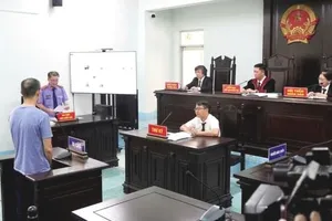 Phiên xét xử hình sự tại tòa án khu vực. Ảnh: SONG MAI