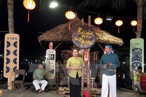 Bai choi is often seen at local spring festivals and resembles a game, using playing cards and village huts. (Source: VNA)