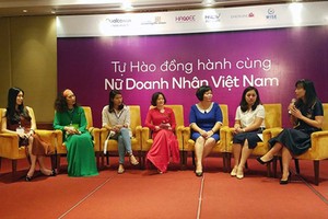 Vietnamese businesswomen are discussing the project DevelopHer at its introduction on June 14 in Hanoi. Photo by Tran Binh