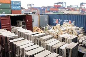 Hundreds of used home electronics banned from import found in containers at Cat Lai Port in HCM City. (Photo: VNA)