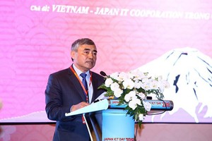 Deputy Minister Nguyen Minh Hong delivered his speech at the 12th Japan ICT Day 2018 on August 29. Photo by Tran Binh