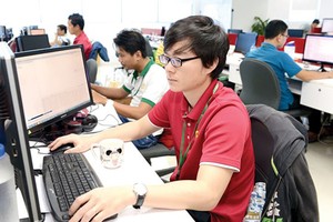 Software programmers work in Quang Trung Software City. Photo by Viet Dung