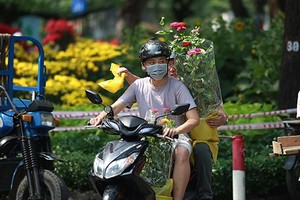 City dwellers flock to buy flowers yesterday