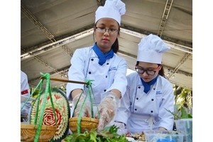 Young cooks are displaying their dishes in a tourism festival in Ho Chi Minh City