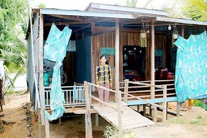 A poor resident in Long An Province live in dilapidated house but she doesn't want to ask for construction loan for Fear not being able to repay loans (Photo: SGGP)