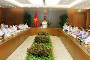 The meeting of the national financial and monetary policy advisory council in Hanoi on September 25 (Photo: VNA)