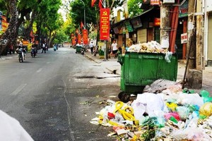 Tons of trash build up across downtown Hanoi