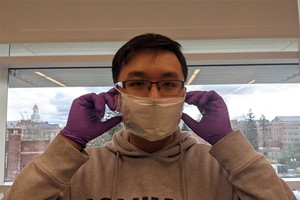 A member of the research team wears the prototype of disposable face masks invented from autolytic piezoelectric polymer sheet. — Photo vietnamnet.vn