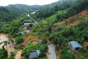 Rainfall-induced landslide, flashflood sweep away killing two people
