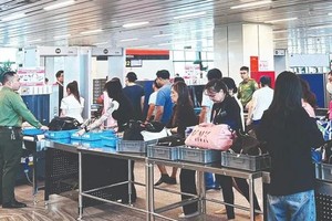 Holiday travel surge strains roads and airports across country