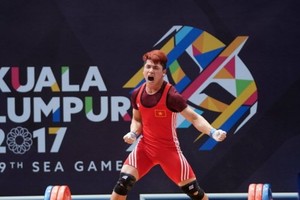 Weightlifter Trinh Van Vinh wins gold medal (Photo:Dung Phuong)