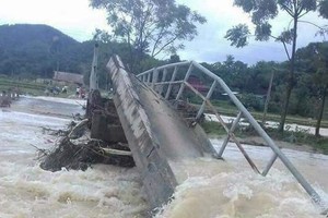 Flash flood sweeps away a local bridge
