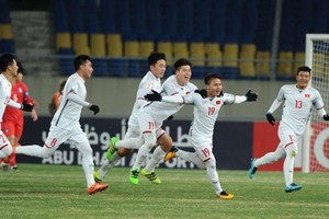 Midfielder Nguyen Quang Hai (No 19) celebrates a goal for Vietnam team in the finals of the AFC U23 Championship held in China ​on January 10. (Photo the-afc.com)